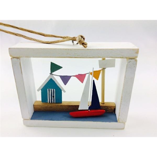 Beachut and sailboat in a framed box