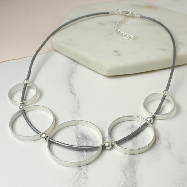 Grey leather necklace with silver circles