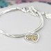 Silver Plated Heart Bracelet With Floral Centre