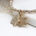 Gold and Grey Bead Bracelet with Double Star Charms